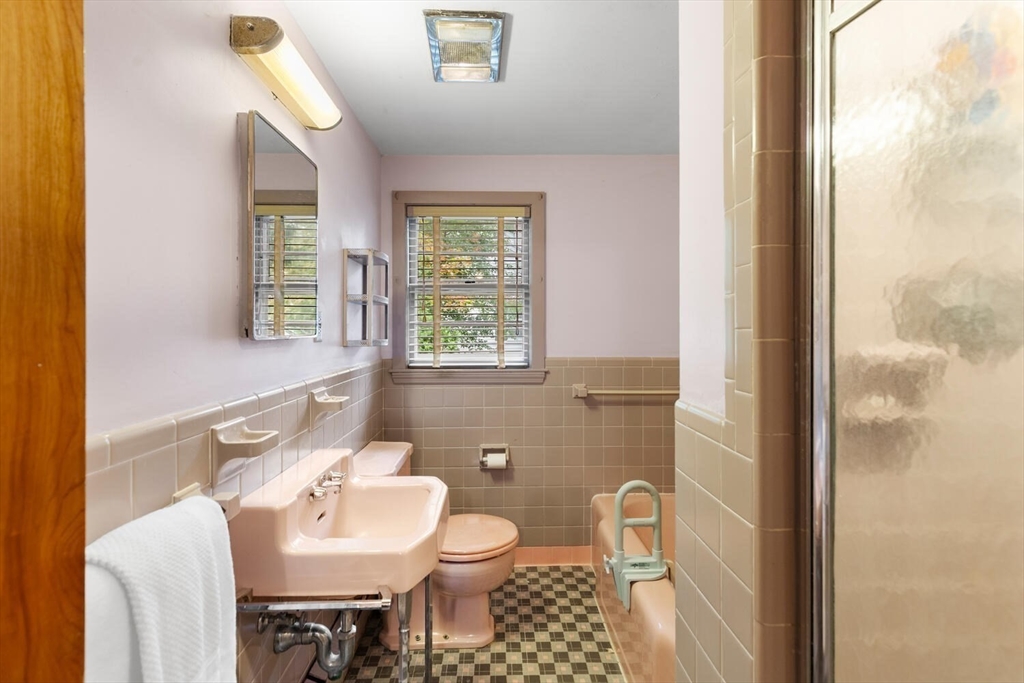 19 Crescent Road Lexington, MA 02421 - Photo 19 of 29 a bathroom with a sink toilet and a mirror