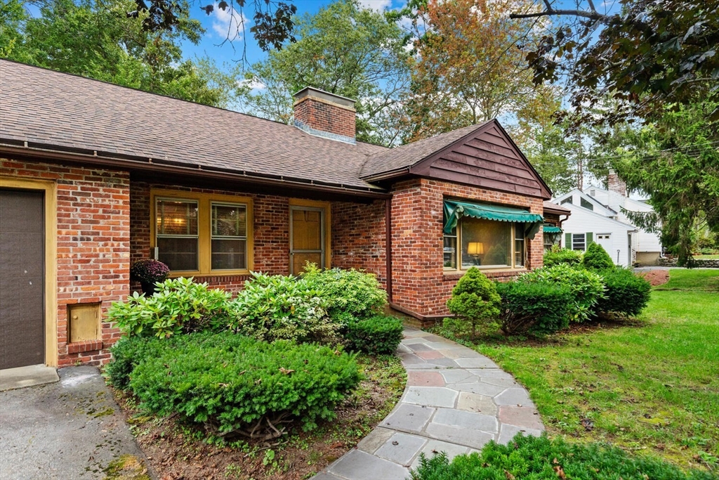 19 Crescent Road Lexington, MA 02421 - Photo 2 of 29 a front view of a house with garden