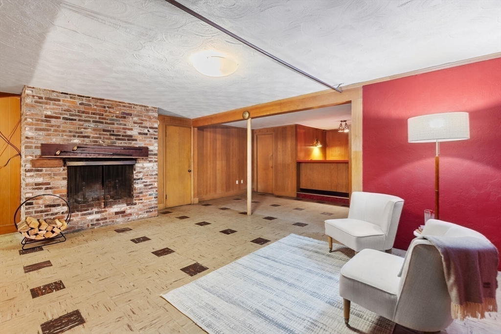 19 Crescent Road Lexington, MA 02421 - Photo 24 of 29 a living room with furniture and a fireplace