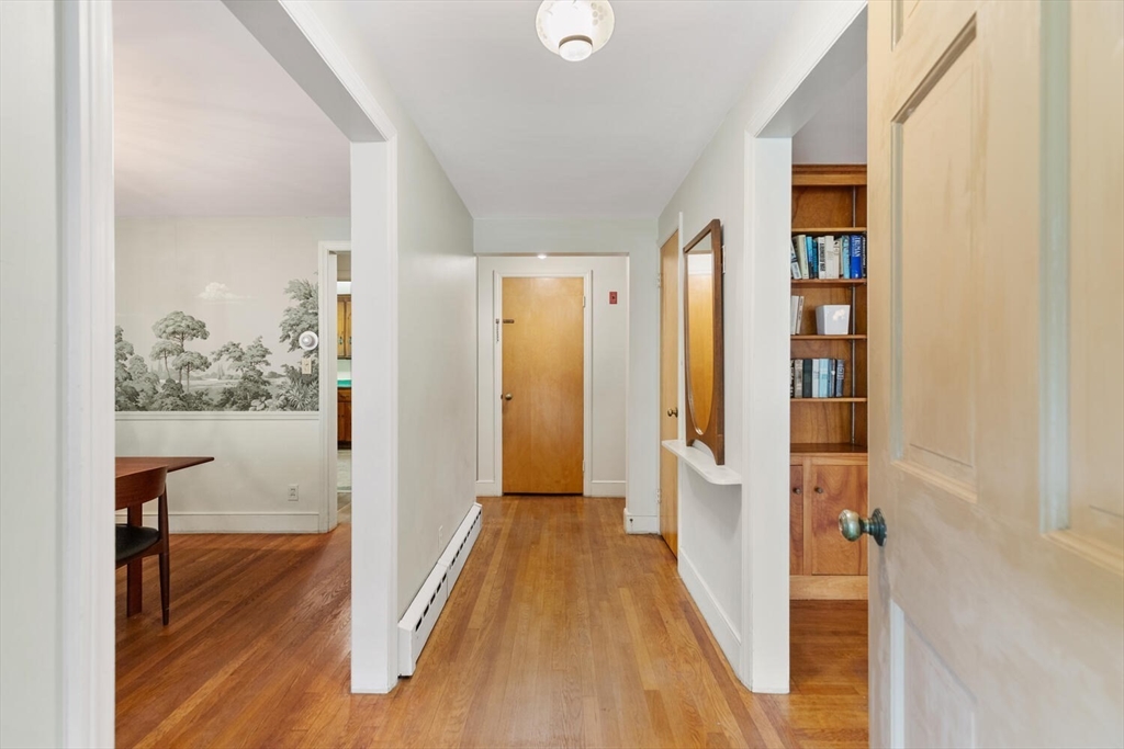 19 Crescent Road Lexington, MA 02421 - Photo 5 of 29 a view of a hallway with wooden floor and front door