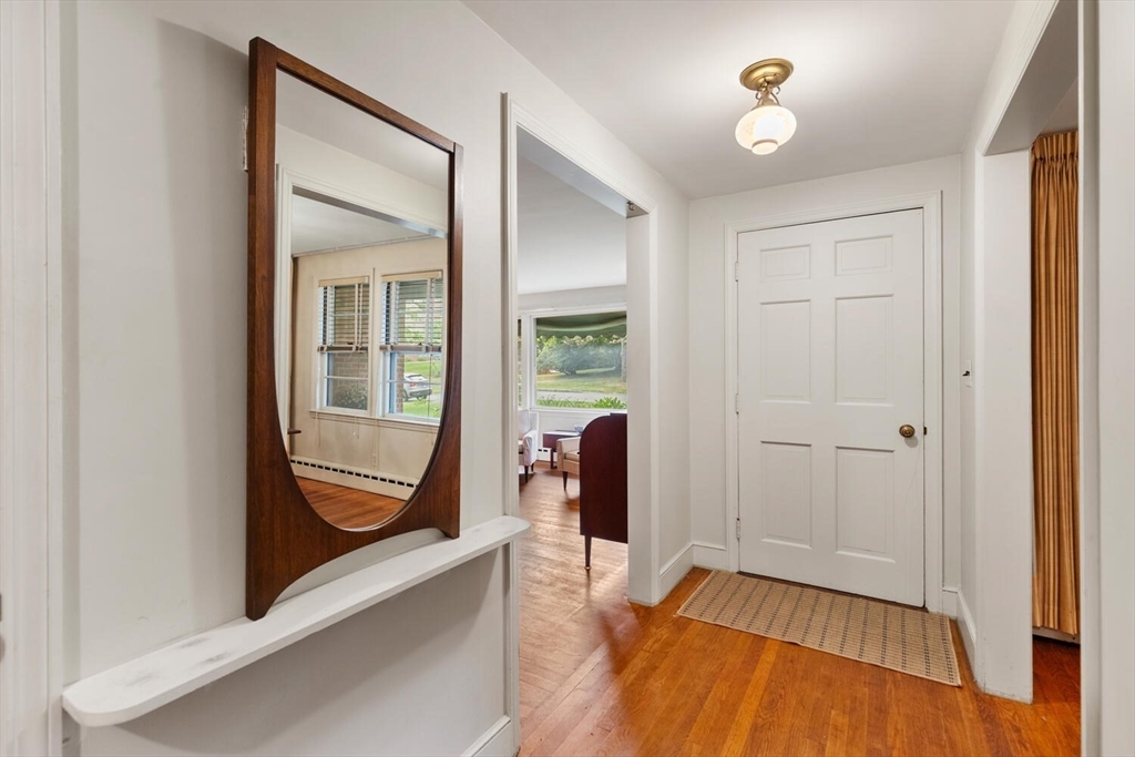 19 Crescent Road Lexington, MA 02421 - Photo 6 of 29 wooden floor in an empty room with a window