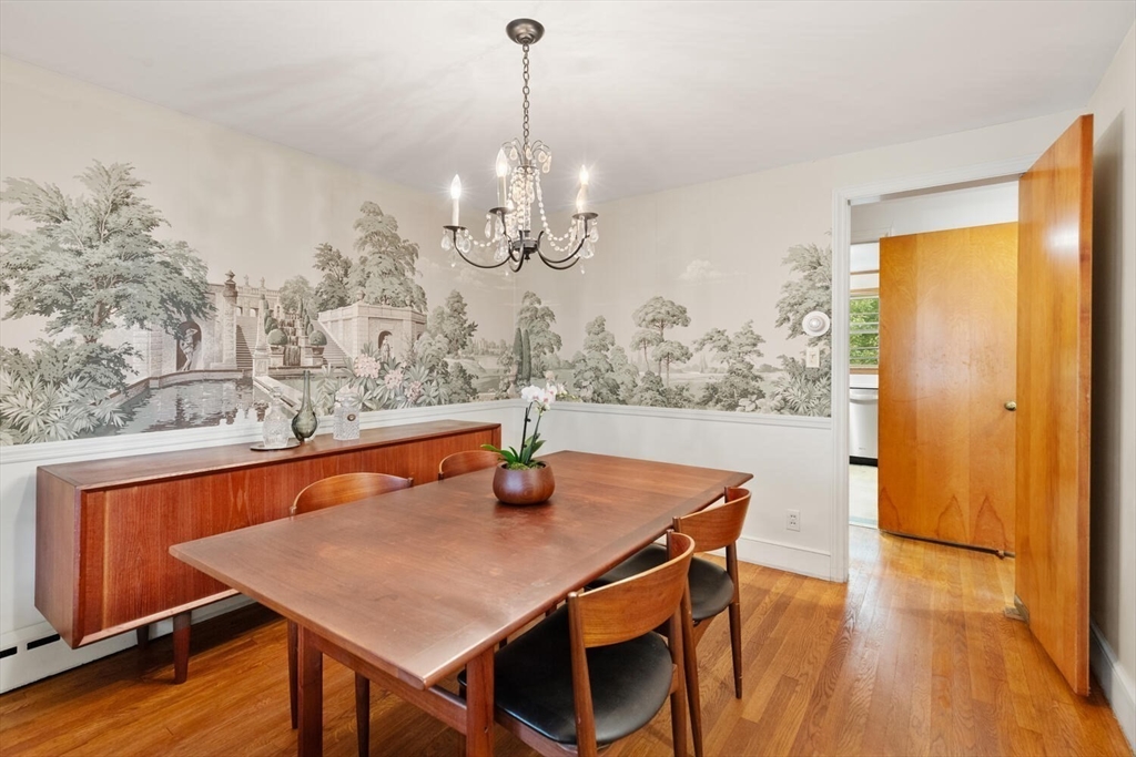 19 Crescent Road Lexington, MA 02421 - Photo 8 of 29 a dining room with large window wooden floor and chandelier