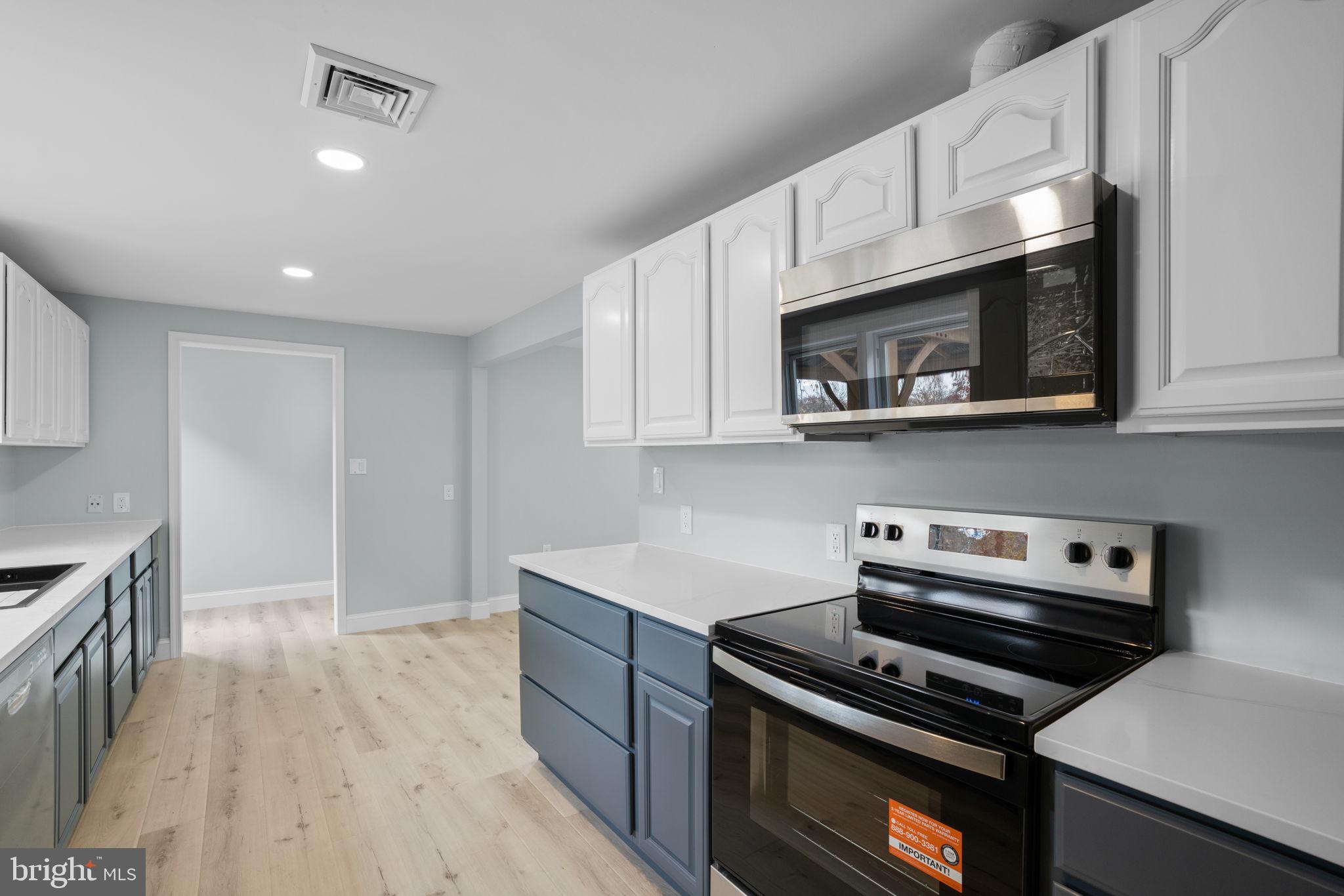 2636 Haddaway Road Sparrows Point, MD 21219 - Photo 16 of 43 a kitchen with cabinets and steel appliances