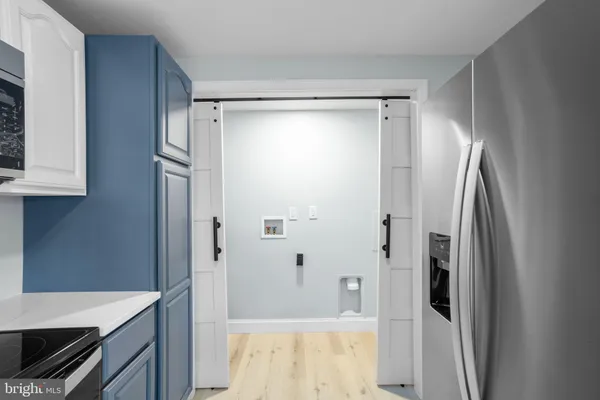 a bathroom with a shower and a sink