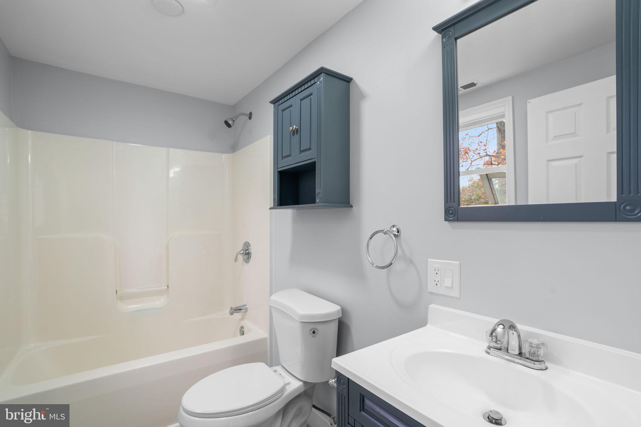2636 Haddaway Road Sparrows Point, MD 21219 - Photo 18 of 43 a bathroom with a sink toilet and shower