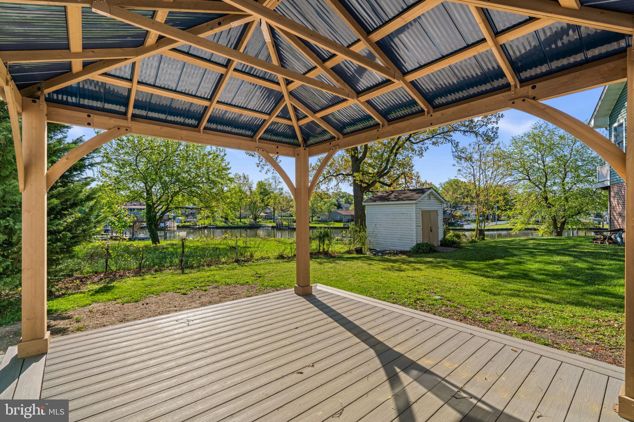 2636 Haddaway Road Sparrows Point, MD 21219 - Photo 19 of 43 a view of a backyard with a garden and deck
