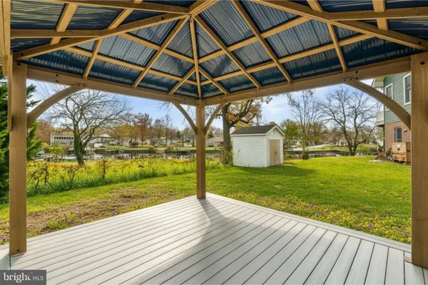 a view of a porch with wooden floor