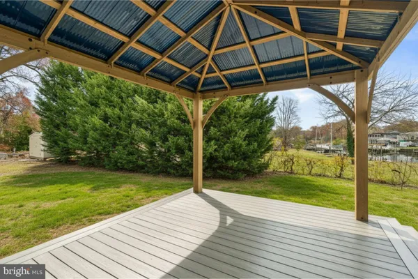 a view of a backyard with wooden floor