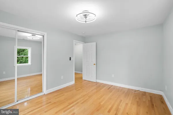 a view of room with wooden floor