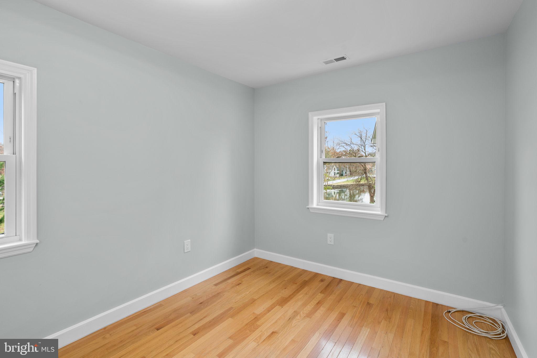 2636 Haddaway Road Sparrows Point, MD 21219 - Photo 27 of 43 a view of an empty room with wooden floor and a window
