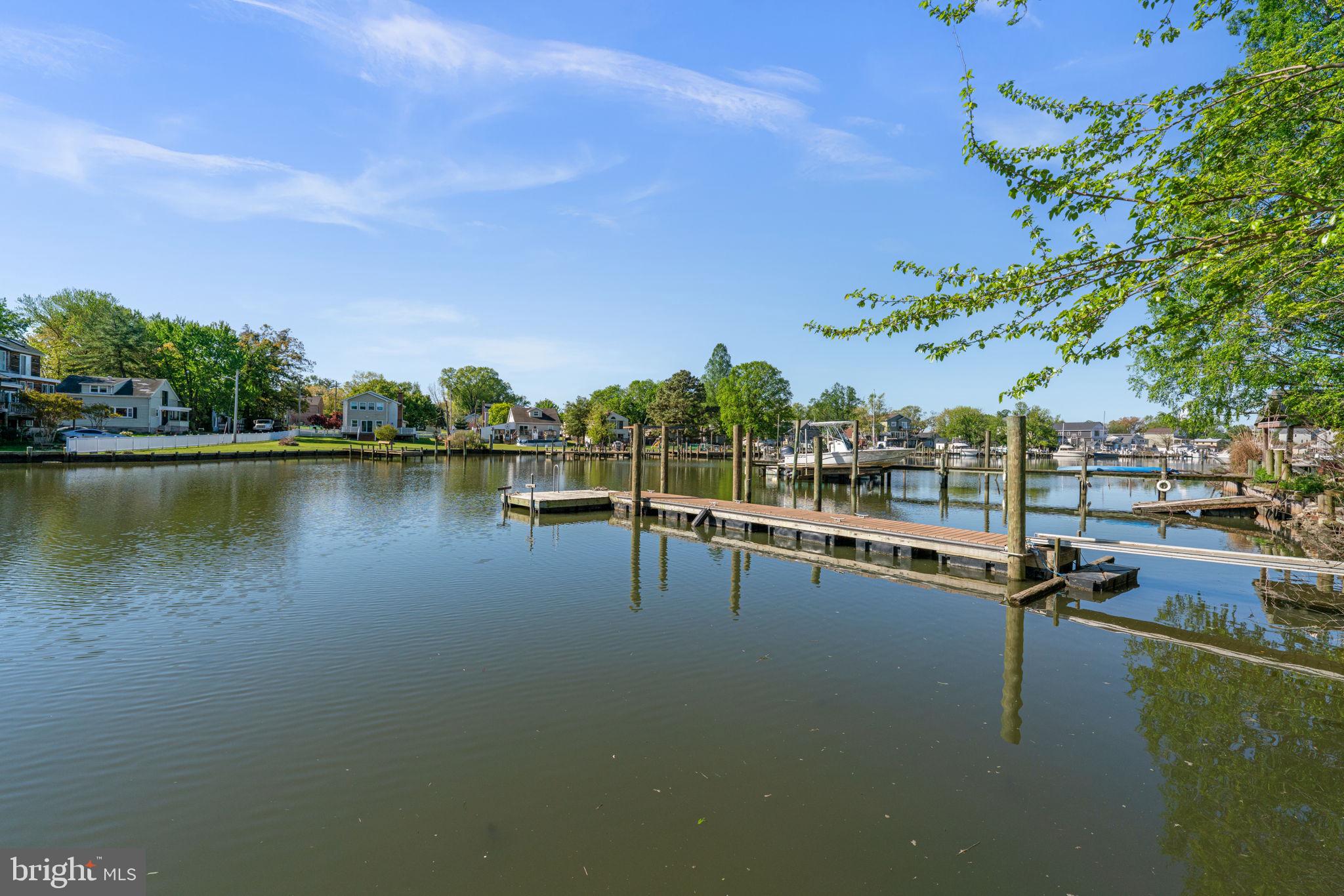 2636 Haddaway Road Sparrows Point, MD 21219 - Photo 33 of 43 a view of swimming pool with outdoor seating and lake view