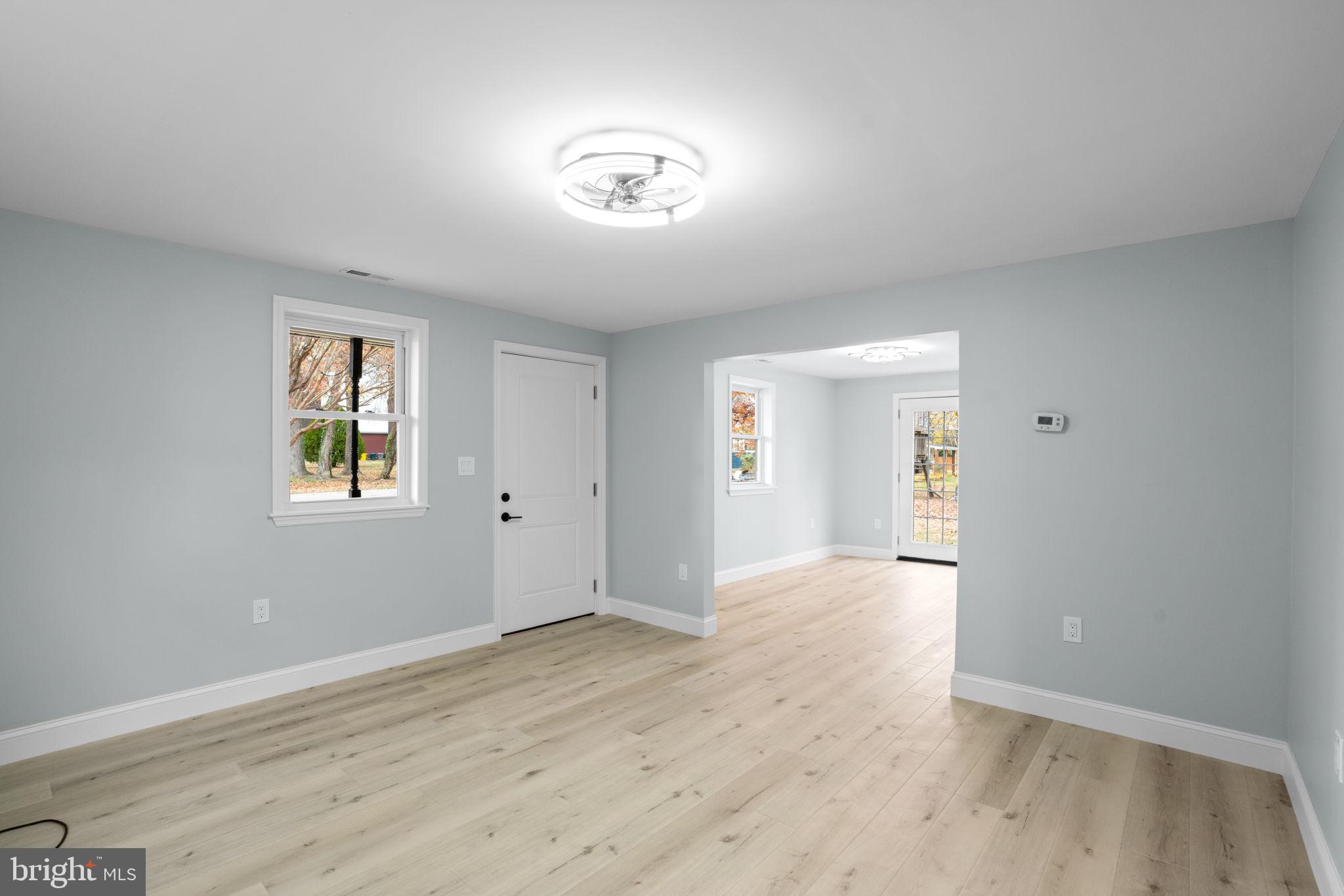 2636 Haddaway Road Sparrows Point, MD 21219 - Photo 4 of 43 a view of an empty room with wooden floor and a window