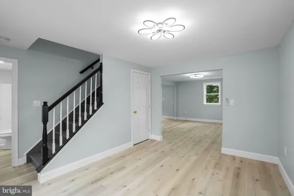 a view of an entryway with wooden floor
