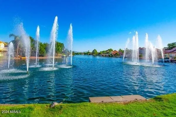 a view of a lake with a house and a boat