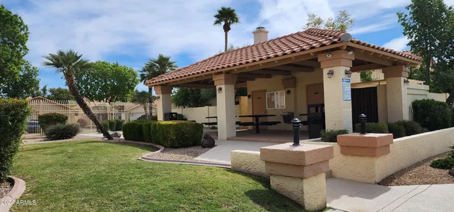 a front view of a lake with palm trees