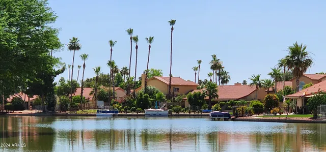 a view of a house with a garden and pathway
