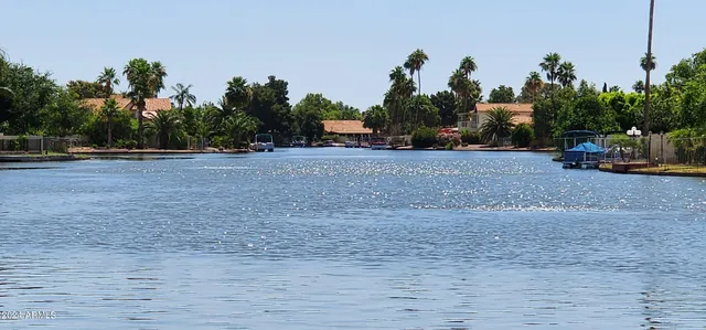 a view of a house with backyard porch and sitting area