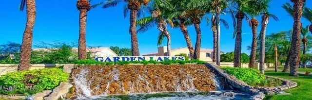 a front view of a white house with a yard