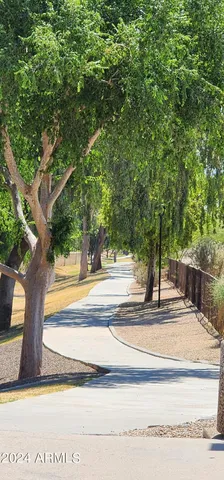 an aerial view of residential houses with outdoor space and lake view