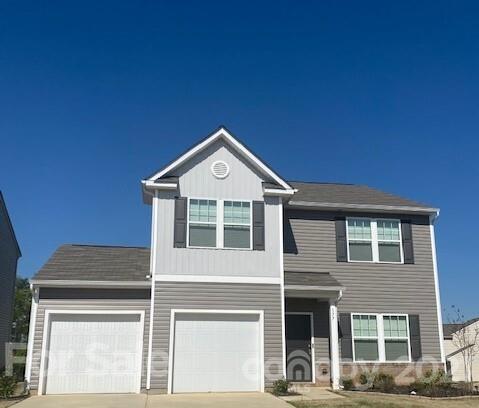 177 Hidden Lakes Road Statesville, NC 28677 - Photo 1 of 3 a front view of a house with a yard