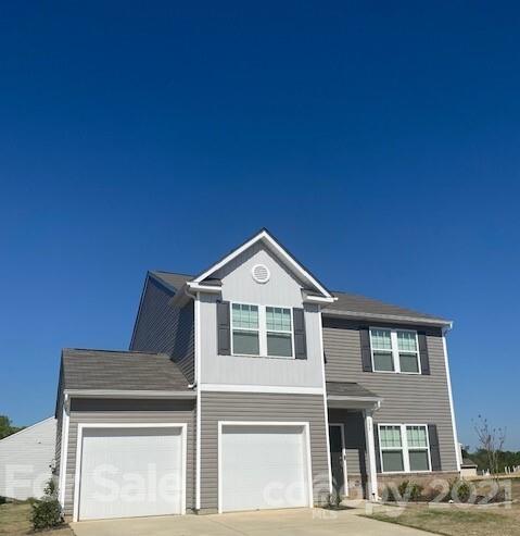 177 Hidden Lakes Road Statesville, NC 28677 - Photo 2 of 3 a front view of a house with a yard