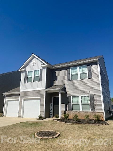 177 Hidden Lakes Road Statesville, NC 28677 - Photo 3 of 3 a front view of a house with a yard