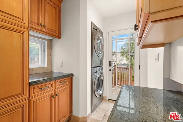 a view of a hallway with a washer and dryer