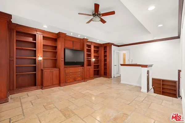 a view of a livingroom with a furniture and a ceiling fan