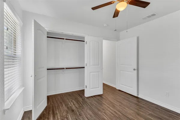 a bath room with a toilet and a bath tub