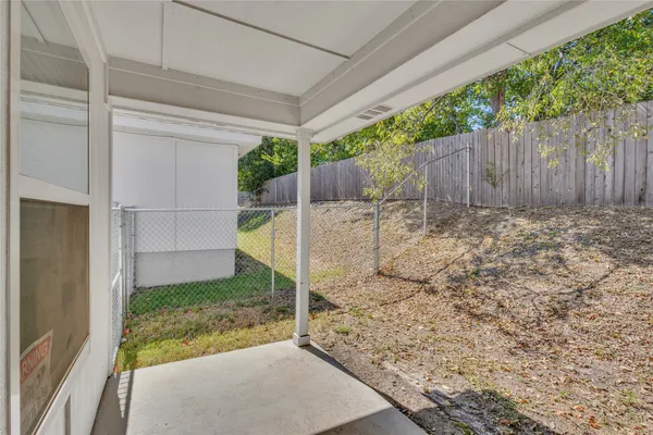 a view of a backyard of the house