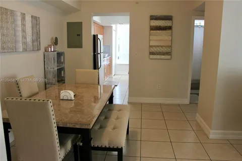 a dining room with furniture and a table