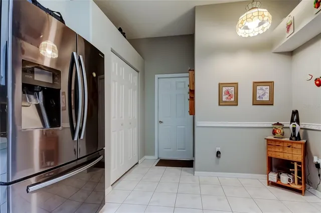a view of a refrigerator and a car in a hall