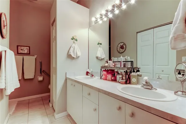 a bathroom with a sink double vanity and a mirror