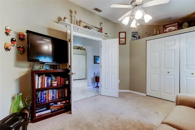 a view of a livingroom with furniture and a flat screen tv