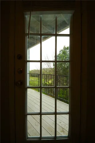 a view of a balcony with wooden floor