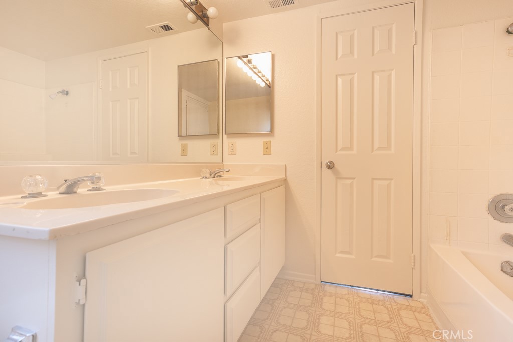 8424 Bayberry Road Rancho Cucamonga, CA 91730 - Photo 22 of 27 a bathroom with a sink and a mirror