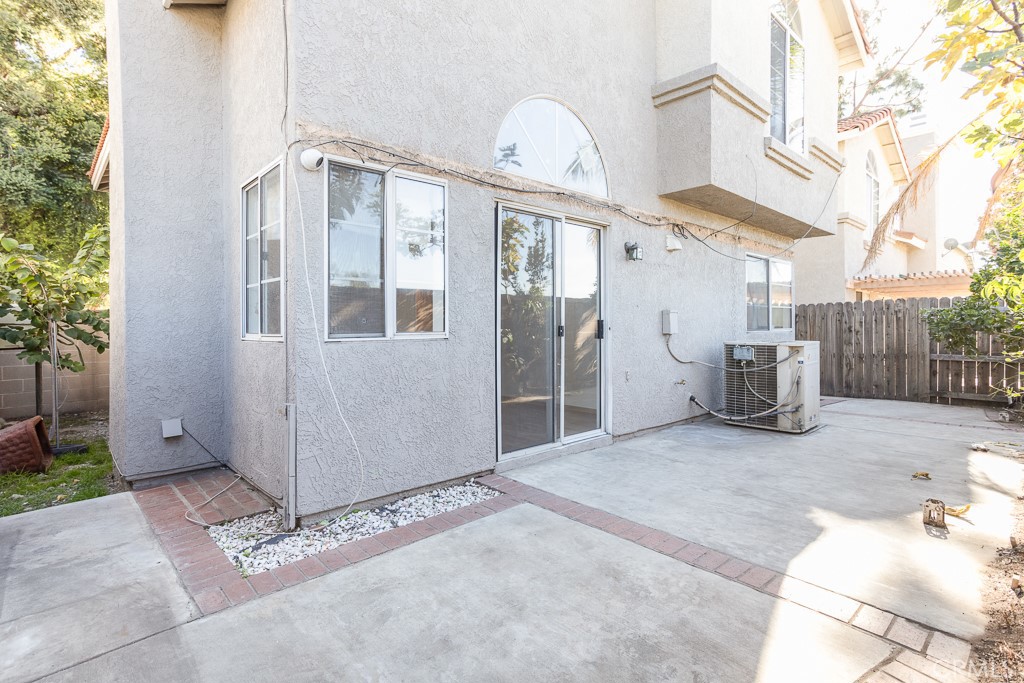 8424 Bayberry Road Rancho Cucamonga, CA 91730 - Photo 26 of 27 a view of a house with a door and wooden walls