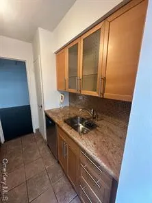 a kitchen with a stove and a cabinet