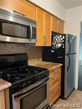 a kitchen with a stove and a microwave