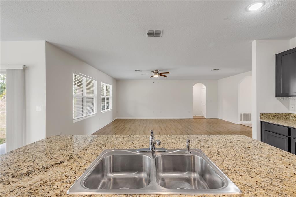 48 Hickory Loop Ocala, FL 34472 - Photo 20 of 52 a kitchen with a sink granite countertop a toilet and a sink