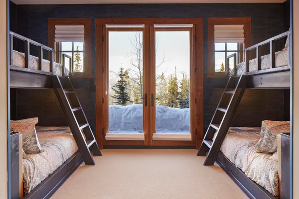 a bed room with a bed and a window