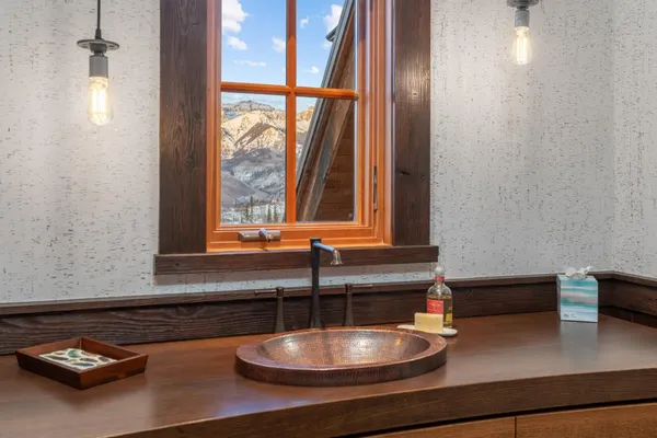 a bathroom with a sink and a window