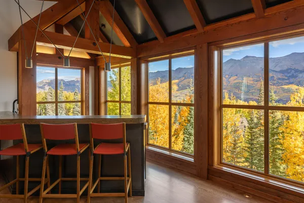 a view of a dining room with furniture window and outside view