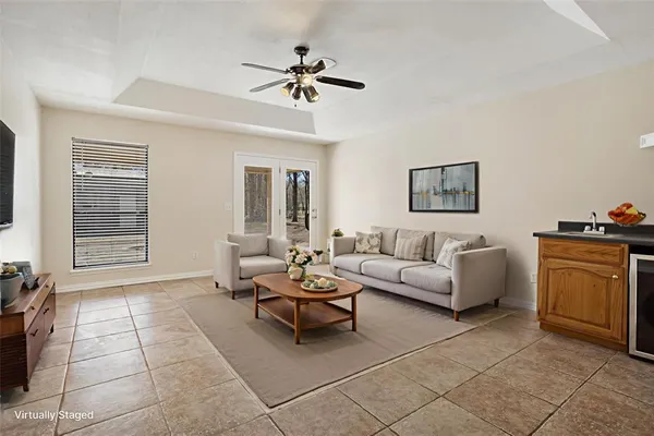 a living room with furniture and a window