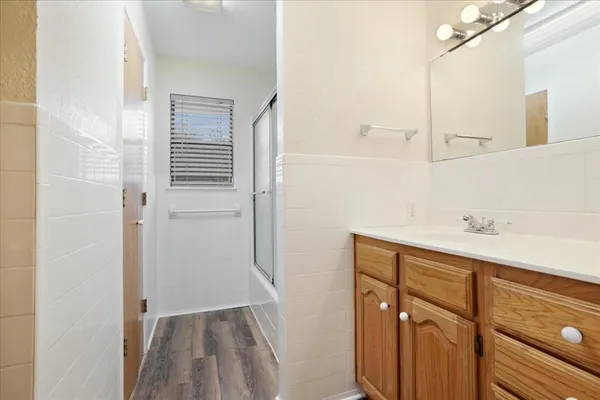 a bathroom with a sink and mirror