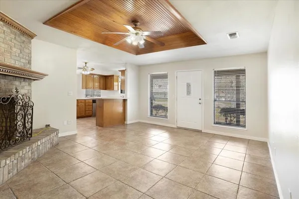 a view of a electric appliances in kitchen and a windows