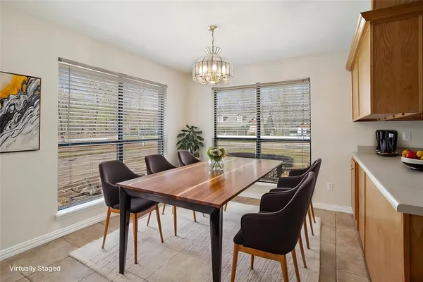 a view of a dining room with furniture window and outside view