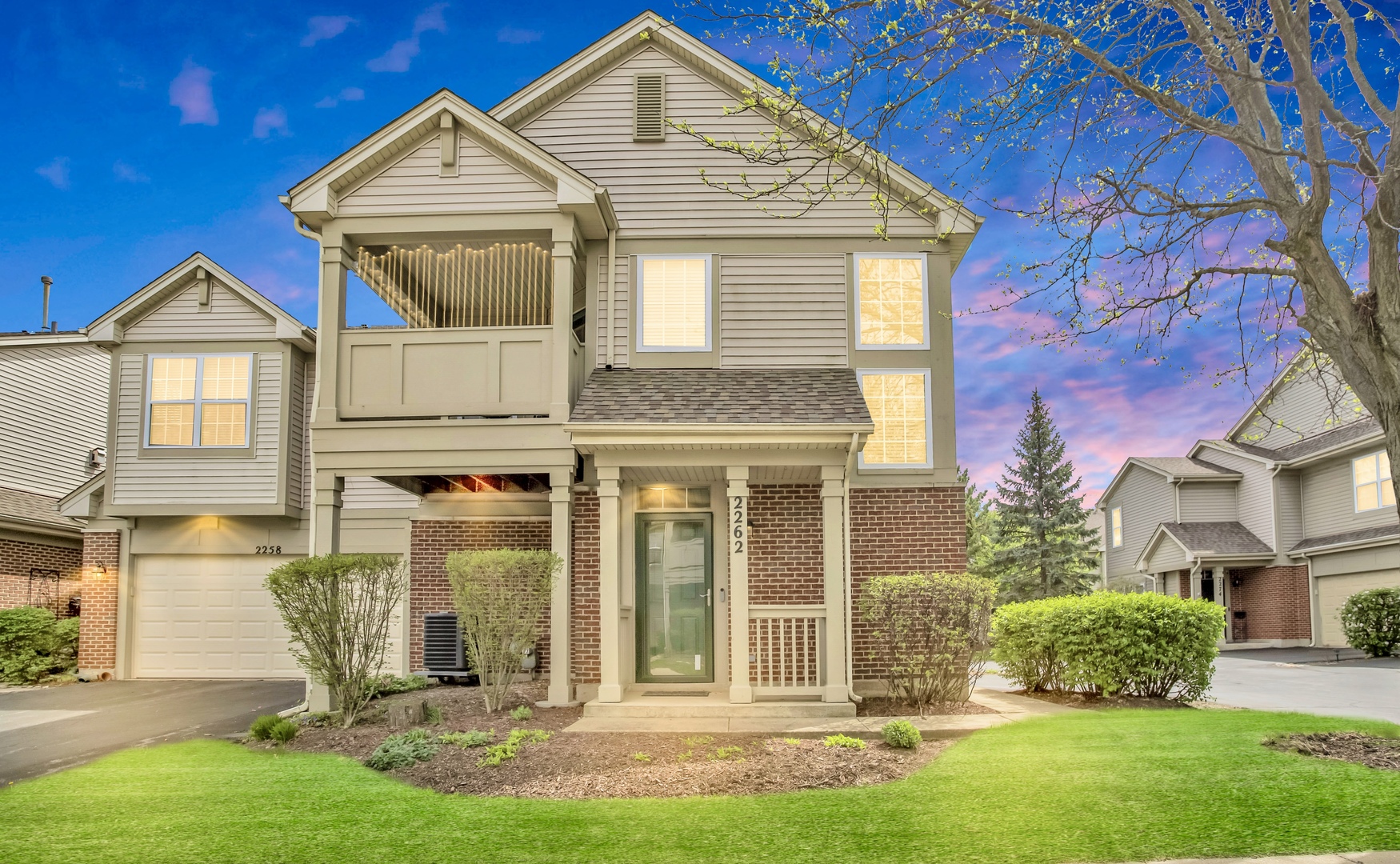 front view of a house with a yard