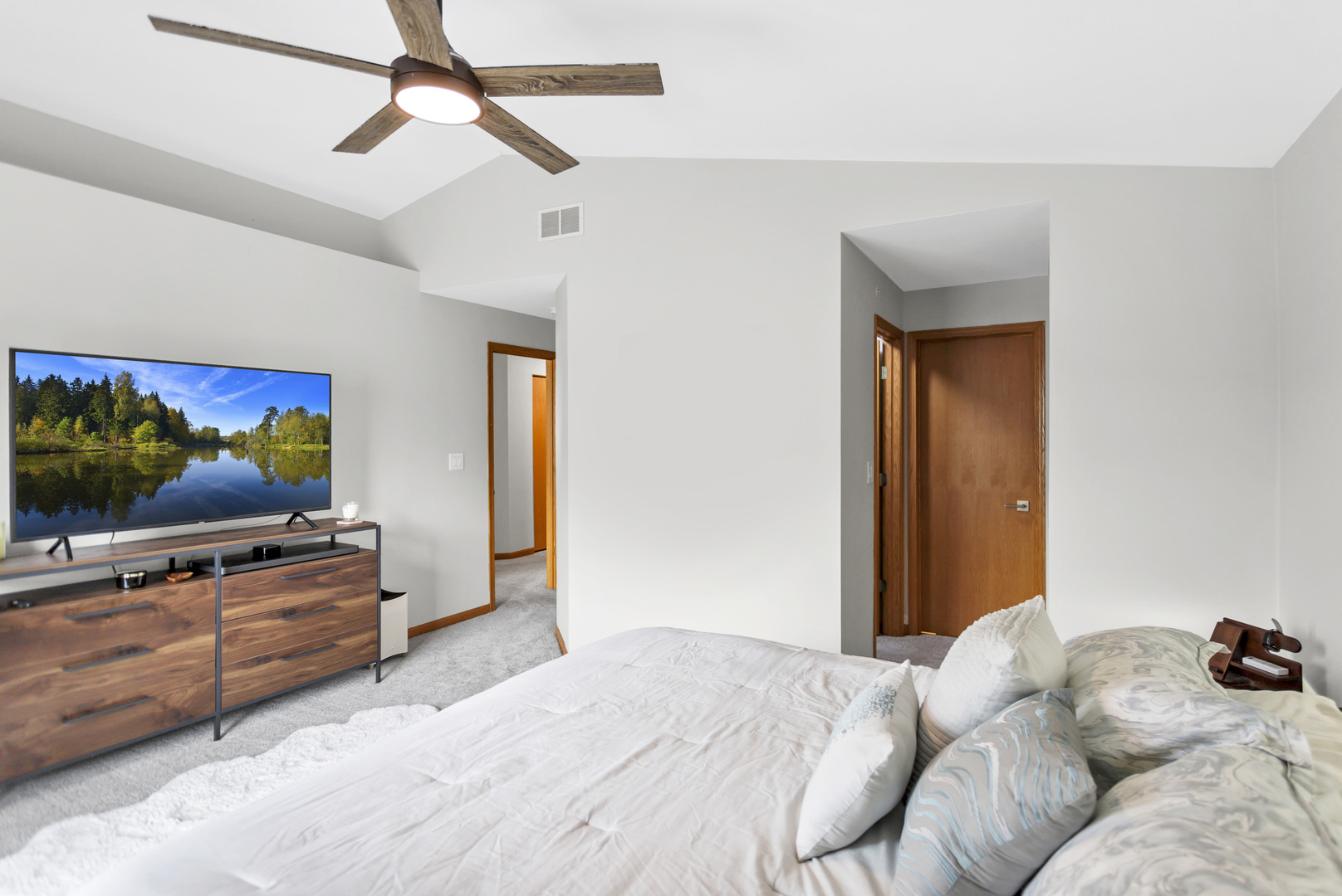 2262 Rockefeller Drive Geneva, IL 60134 - Photo 17 of 25 a bedroom with a bed and flat screen tv