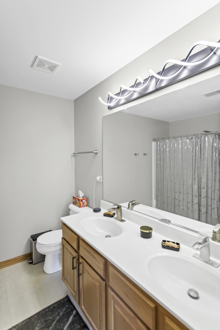 2262 Rockefeller Drive Geneva, IL 60134 - Photo 19 of 25 a bathroom with a sink and a mirror